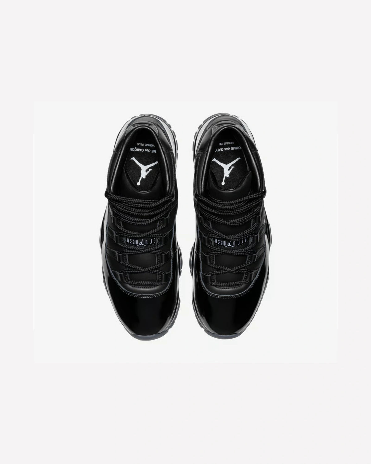 Jordan 11 Retro Comme des Garçons Homme Plus Black — suela exterior