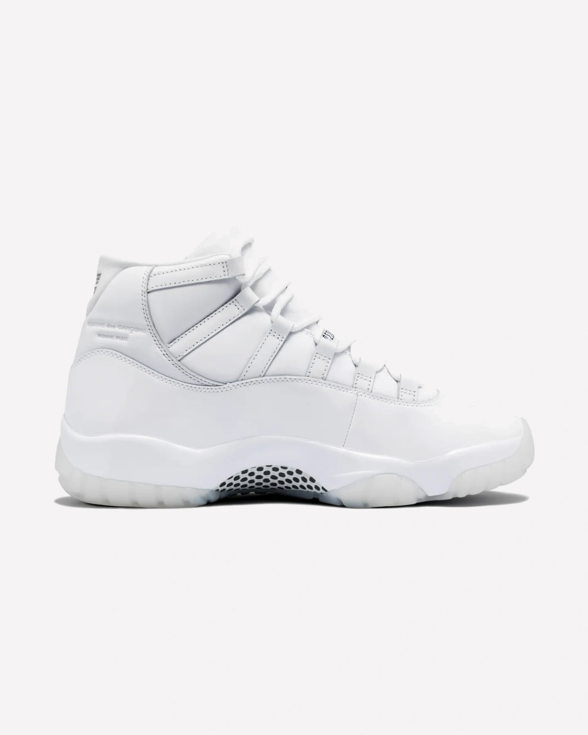 Jordan 11 Retro Comme des Garçons Homme Plus White — detalle del talón