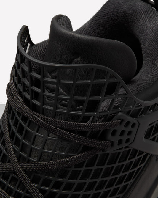 Jordan 4 Retro Net Black — detalle del upper