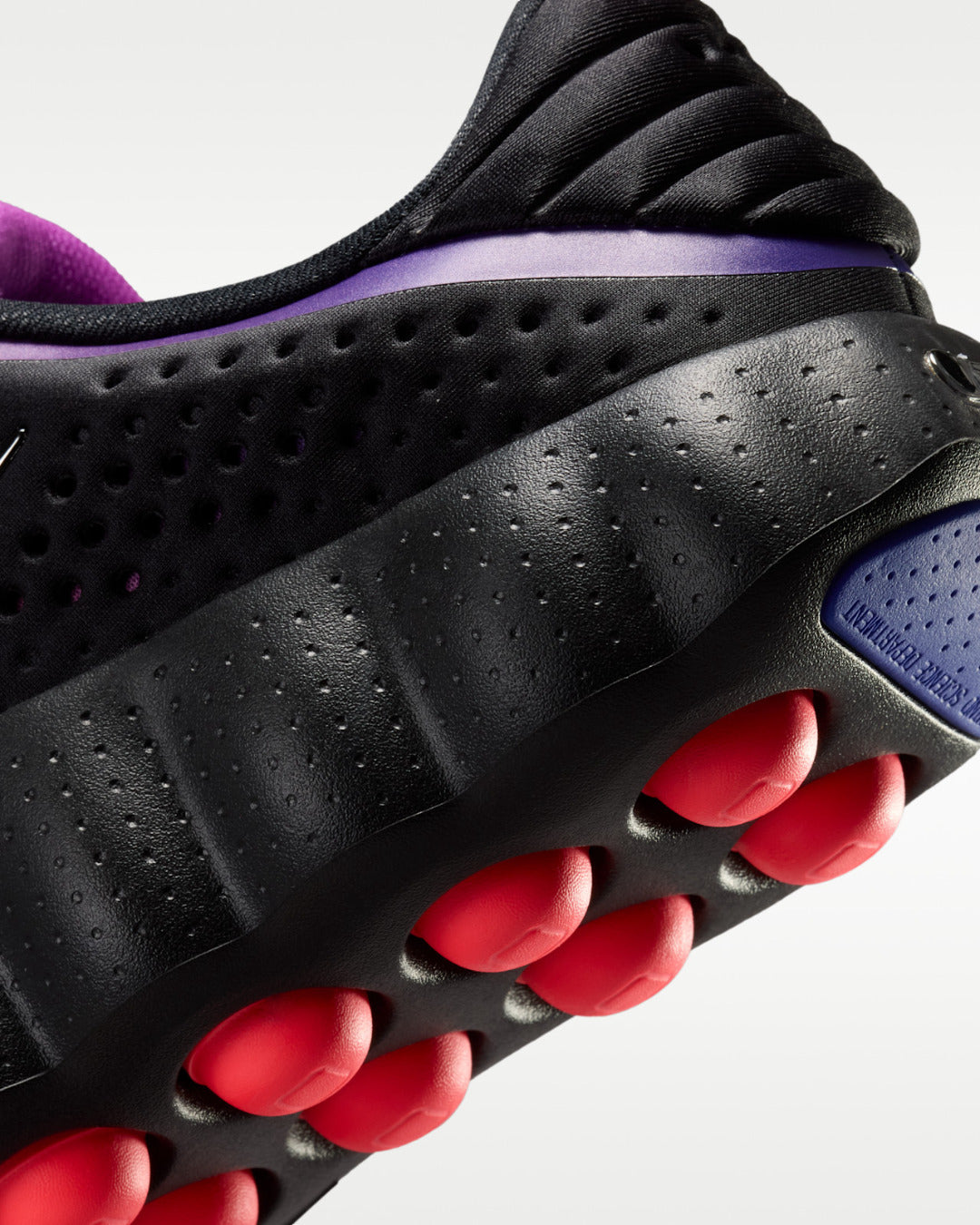 Nike Mind 002 AMP Black Indigo Burst — detalle del talón