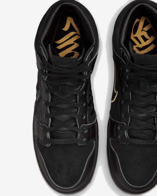 Nike SB Dunk High FAUST Black Gold — detalle del logo